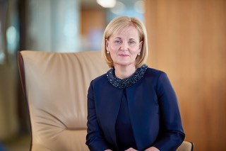 Photograph of Dame Amanda Blanc seated in a chair