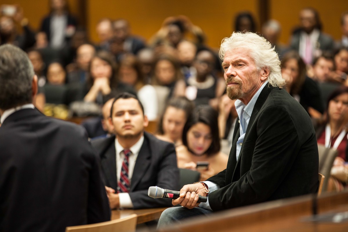 Sir Richard Branson, at right, speaking at a Young Leaders of the Americas Initiative panel